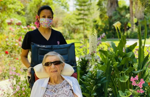 Resident enjoying time outdoors with a caregiver