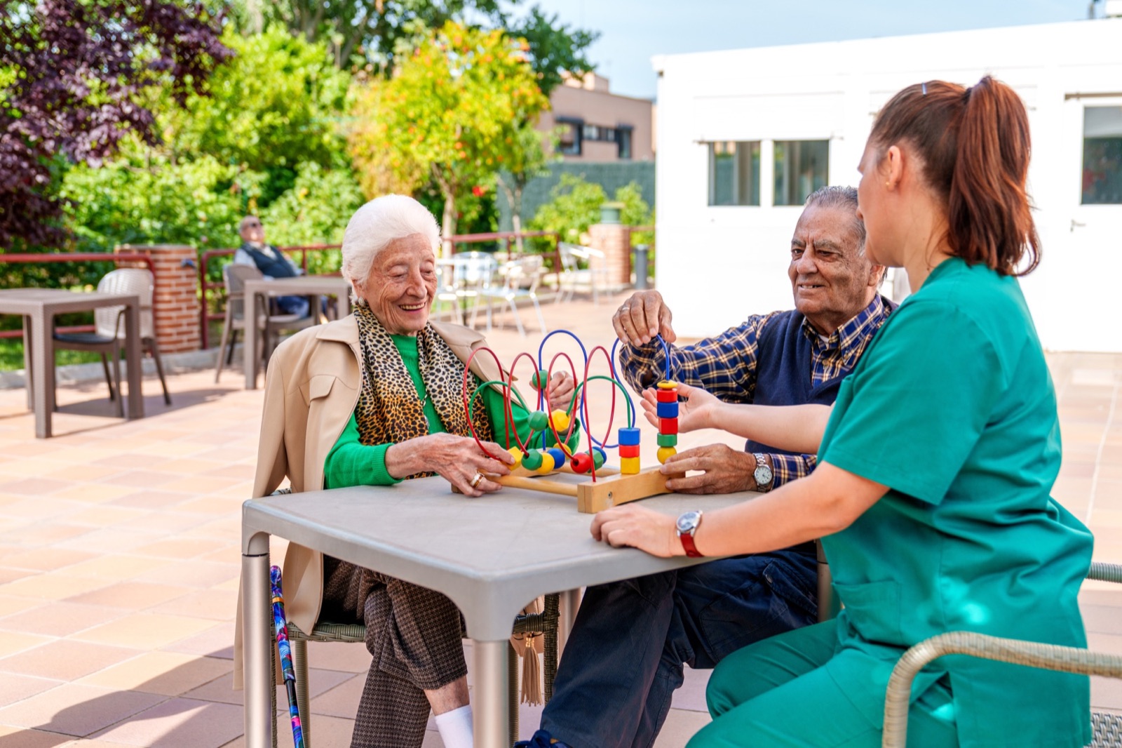Residents enjoying an activity with a caregiver